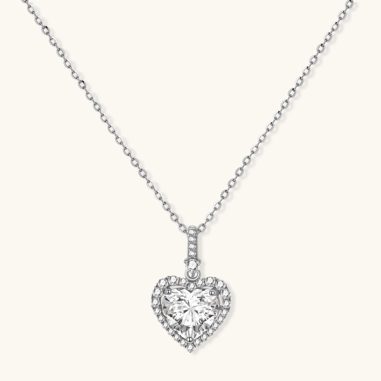 Sterling silver heart pendant necklace with brilliant moissanite center stone and halo setting on delicate chain