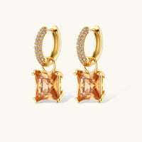 14K gold plated jewelry set featuring square champagne CZ stones with sparkling huggie earrings on cream background.