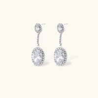 Elegant white gold plated jewelry set with oval cubic zirconia stones in halo settings, featuring Y-necklace and drop earrings.
