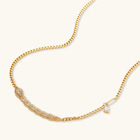 Gold-plated necklace with geometric diamond segments and matching huggie earrings featuring cubic zirconia details
