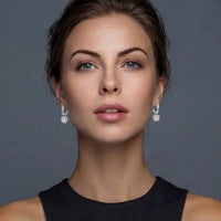 Twisted Infinity Halo Moissanite Earrings by KIAHMILLA