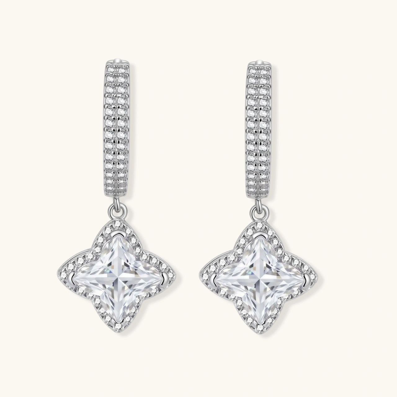 Sterling silver huggie hoops with geometric diamond-shaped moissanite dangles featuring pavé crystal details