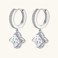 Sterling silver huggie hoops with geometric diamond-shaped moissanite dangles featuring pavé crystal details