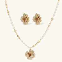 14K gold-plated flower jewelry set with zirconia crystals, featuring dimensional petal necklace and matching earrings