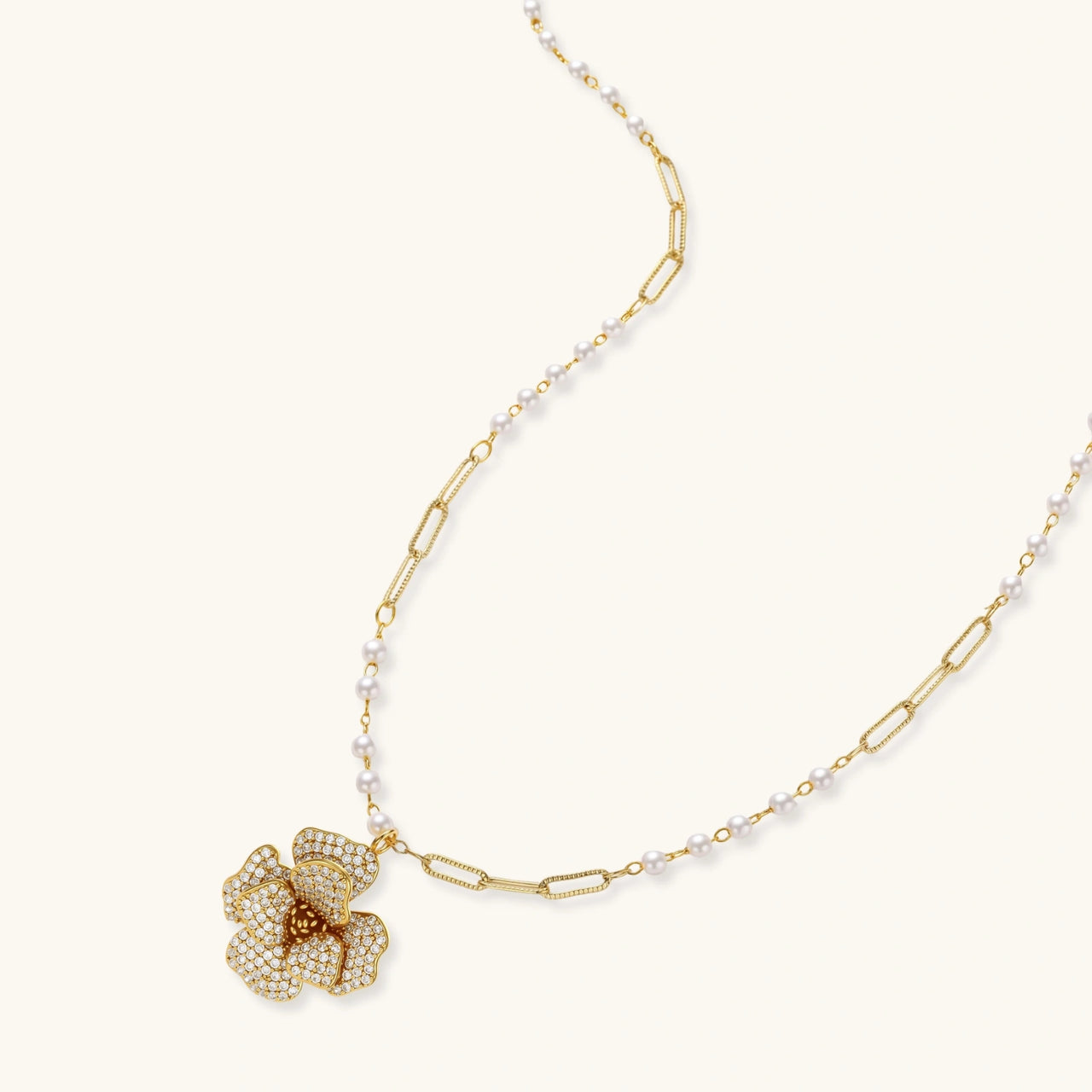 14K gold-plated flower jewelry set with zirconia crystals, featuring dimensional petal necklace and matching earrings