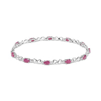 .925 Sterling Silver Pink Oval Shaped Ruby and 1/4 Cttw Diamond 7.25