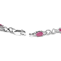 .925 Sterling Silver Pink Oval Shaped Ruby and 1/4 Cttw Diamond 7.25