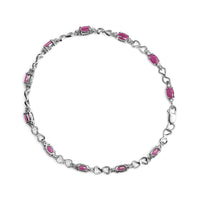 .925 Sterling Silver Pink Oval Shaped Ruby and 1/4 Cttw Diamond 7.25