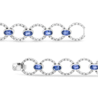 18K White Gold 6 Cttw Diamond and 5x3mm Oval Blue Sapphire Openwork Circle Link Bracelet (F-G Color, SI1-SI2 Clarity) - Size 7