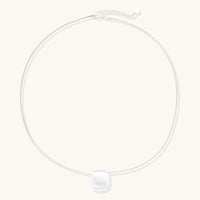 Brushed Silver Disc Necklace with a brushed sterling silver sphere and adjustable chain for minimalist style.