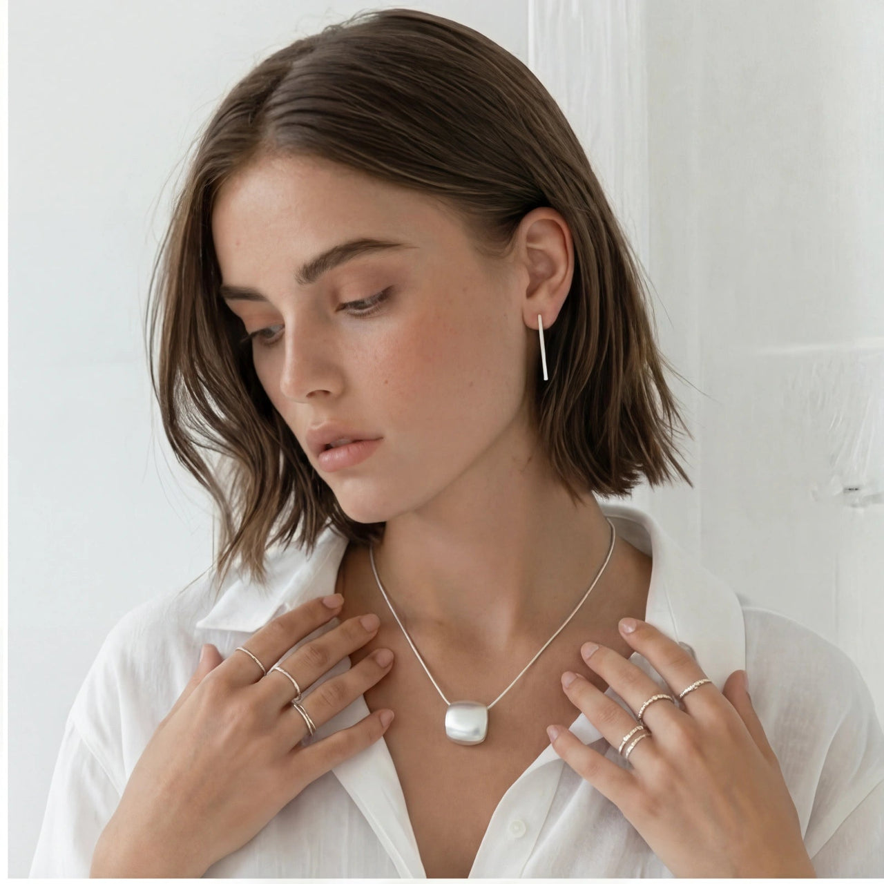 Brushed Silver Disc Necklace worn by a model, showcasing contemporary minimalist design and elegance.