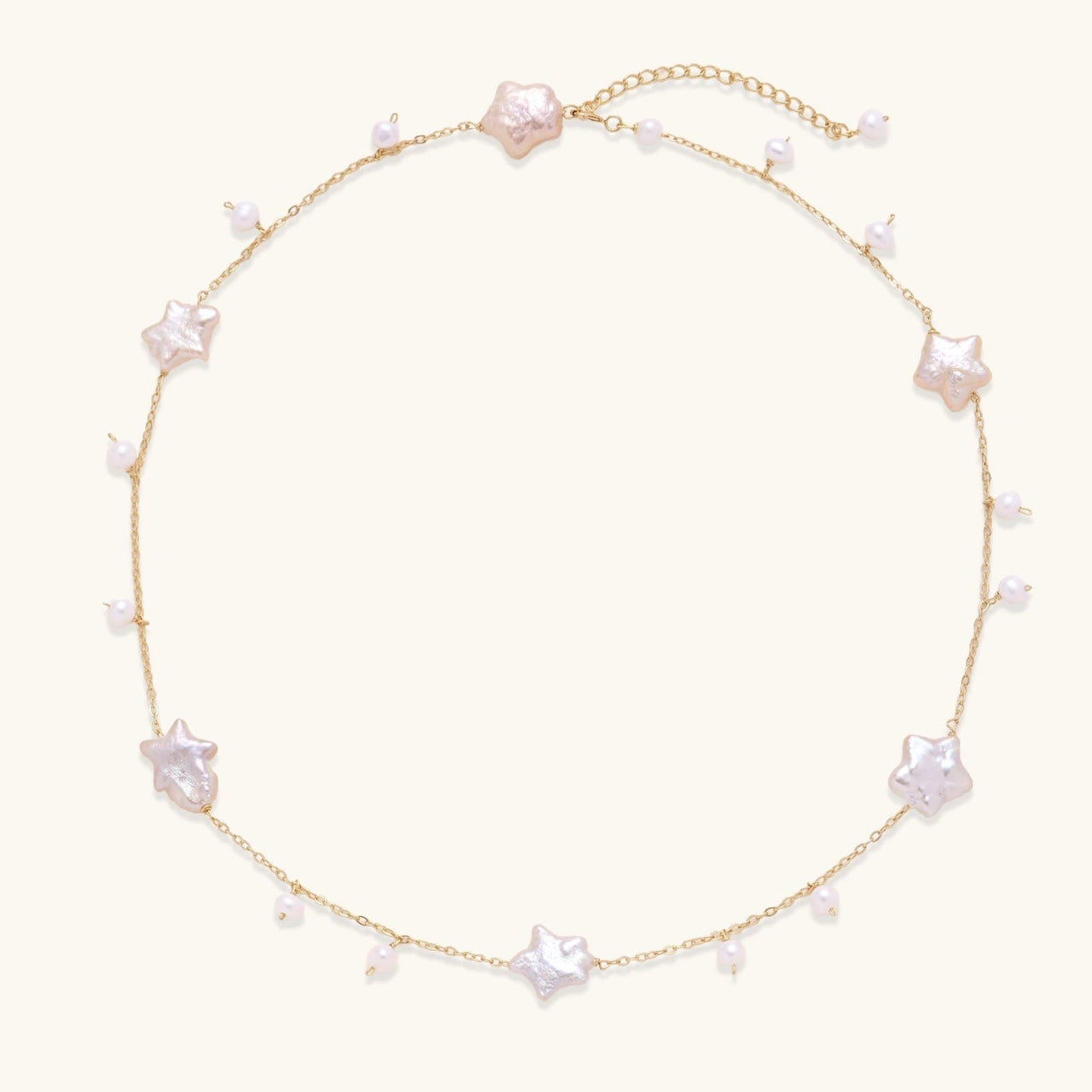 Celestial Pearl Stars Necklace featuring baroque pearls and 18K gold vermeil, adjustable length for versatile styling.