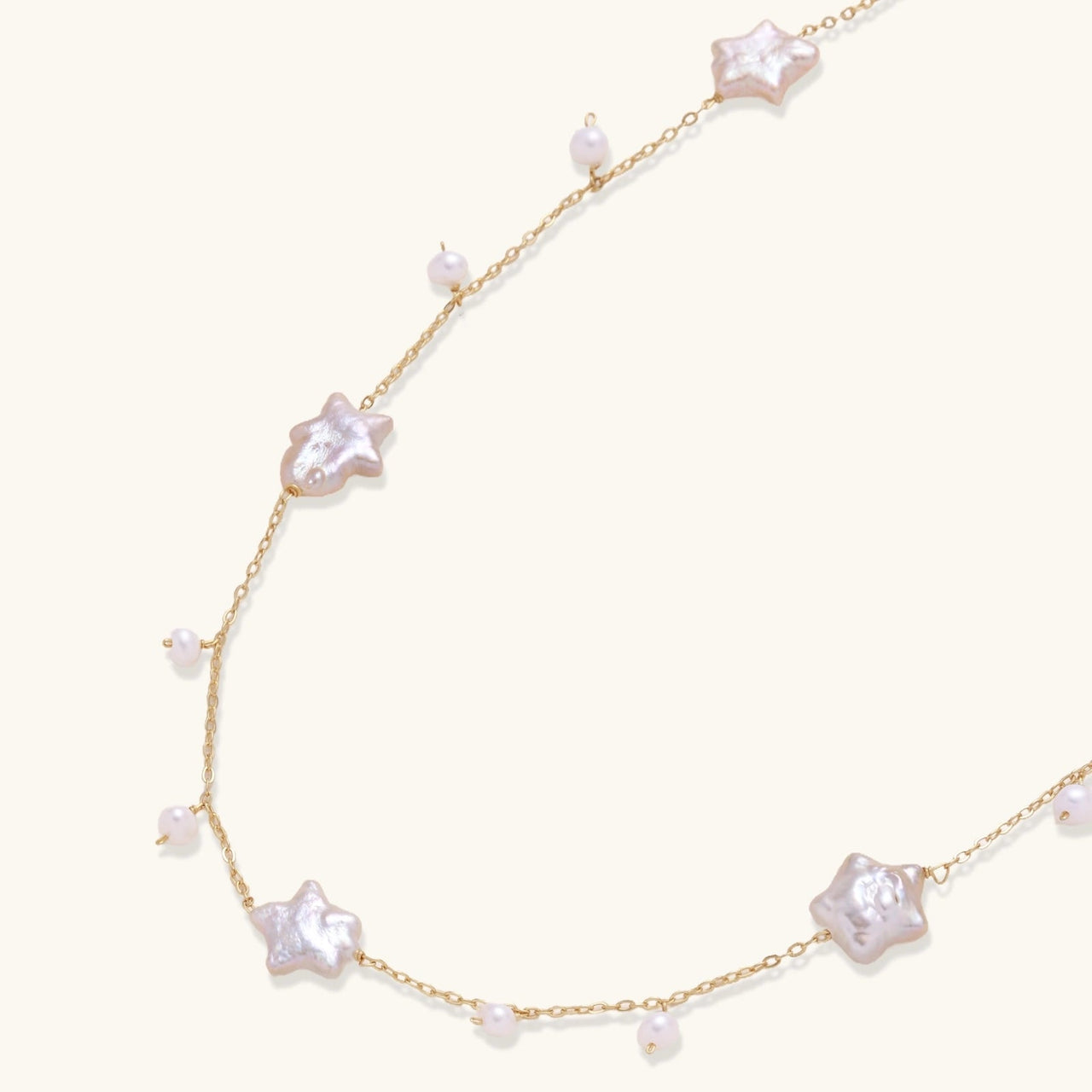 Celestial Pearl Stars Necklace featuring baroque pearls shaped like stars on gold vermeil chain.