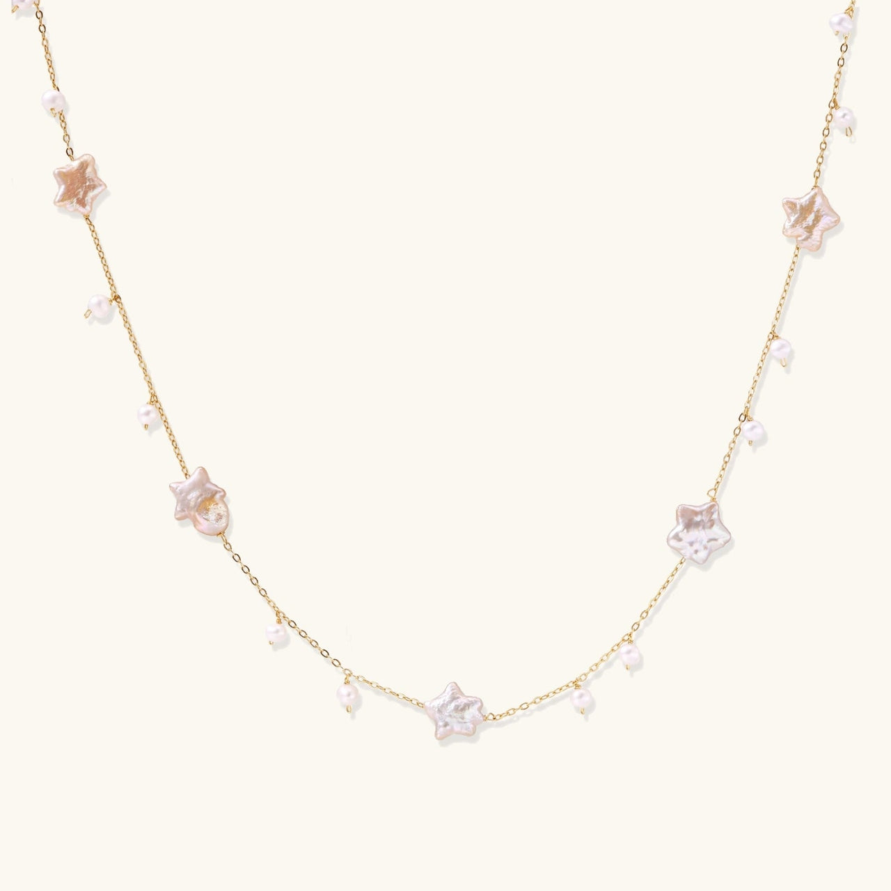 Celestial Pearl Stars Necklace featuring baroque pearls and 18K gold vermeil, perfect for celestial-themed style.