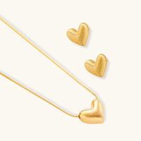 Golden Heart Necklace with matching heart-shaped earrings in 18K gold plating, perfect for layering.