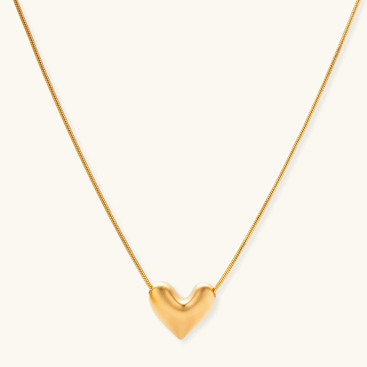 Golden Heart Necklace featuring a dainty heart pendant in 18K gold-plated sterling silver on an adjustable chain.