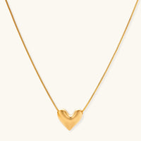 Golden Heart Necklace featuring a dainty heart pendant in 18K gold-plated sterling silver on an adjustable chain.