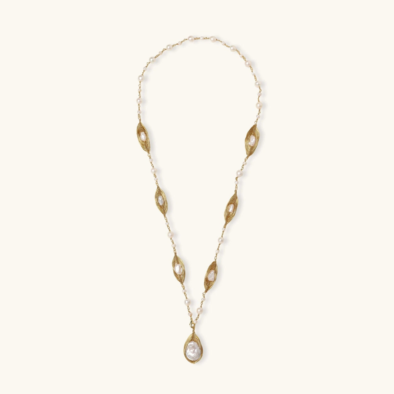 Golden Leaf Baroque Necklace featuring freshwater pearls and gold-plated leaves for a stunning look.