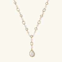 Lumina Pearl Station Necklace featuring freshwater pearls and a baroque pearl pendant on a gold-plated chain.
