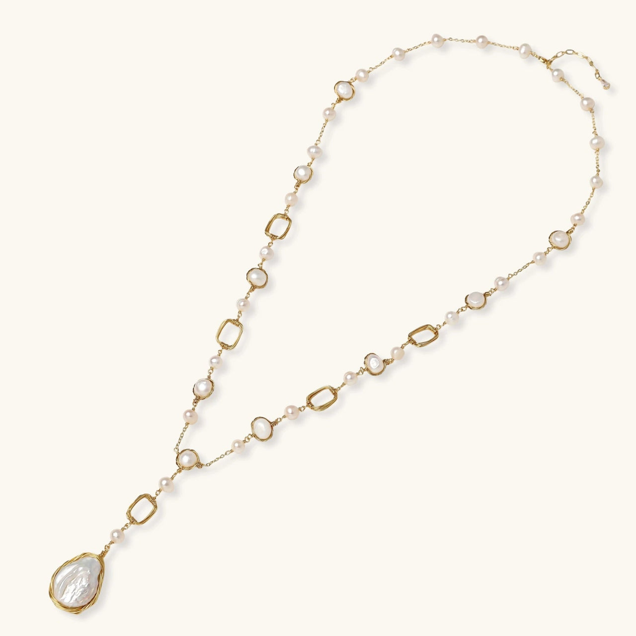 Lumina Pearl Station Necklace featuring baroque pearls and gold-plated chain, perfect for elegant occasions.