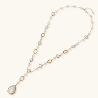 Lumina Pearl Station Necklace featuring baroque pearls and gold-plated chain, perfect for elegant occasions.