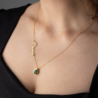 Personalized Cursive Name & Birthstone Necklace featuring a cursive name and green birthstone on a gold chain.