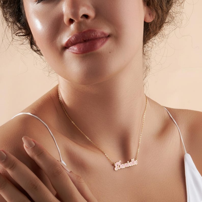 Personalized Cursive Name Necklace worn by a woman, featuring the name 'Danielle' in elegant cursive design.