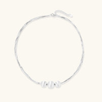 Silver Strand Layers Necklace featuring three brushed sterling silver beads and delicate multi-strand chains.