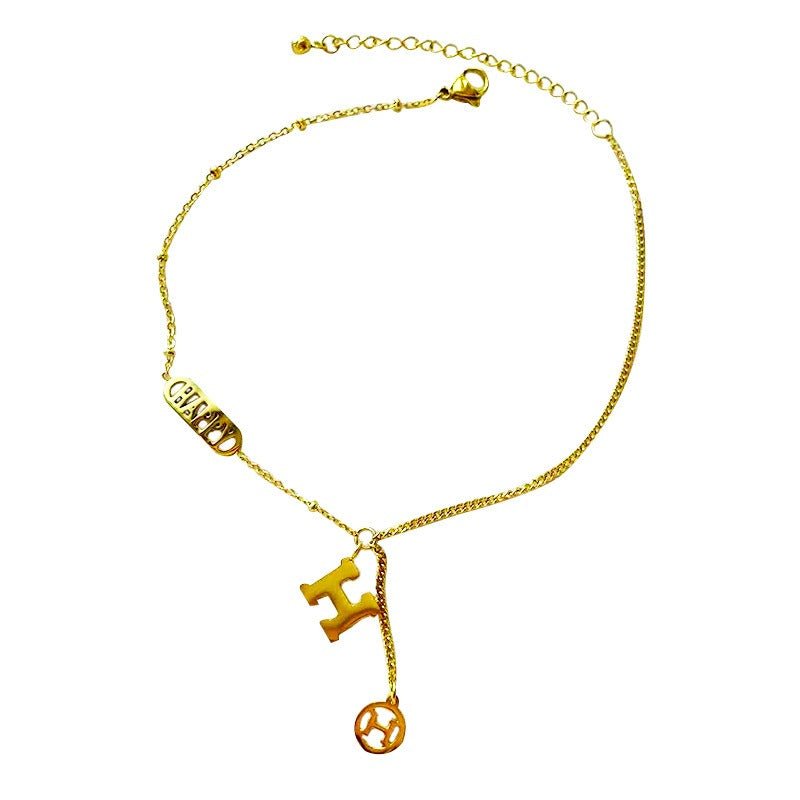 Titanium steel and 18k gold letter H tassel anklet - KIAHMILLA