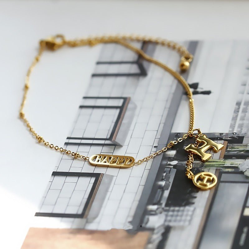 Titanium steel and 18k gold letter H tassel anklet - KIAHMILLA